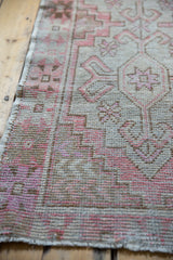 Distressed Oushak runner texture detail, even wear with foundation showing, blush and silver.