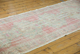 Distressed Oushak runner pile, even wear, muted rose, ivory, pale sea-foam green.