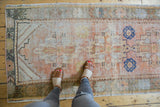 Textural vintage Oushak runner with mostly even wear, featuring pale rust and cobalt motifs.