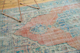 Worn texture and soft palette, showing knot heads on this distressed Oushak carpet.