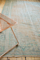 Softly textured vintage Oushak rug, distressed beige and mint green colors.
