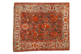 Square antique Persian Malayer rug with allover palmettes and vinery in red, orange, and deep brown.