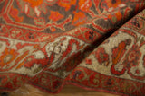 Close-up detail of the even low pile and delicate vinery on an antique Persian Malayer rug.