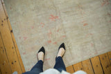 Textured view of a distressed vintage Oushak rug with subtle pale terra cotta motifs.
