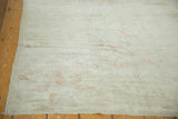 Vintage distressed Oushak rug, soft texture with subtle pale terra cotta designs.