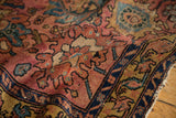 Antique Persian Lilihan rug detail: raspberry, dusty gold, deep blue floral palmettes, low pile.