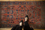 Vintage Lilihan rug, raspberry red field, allover floral with contoured leaves, even pile wear.