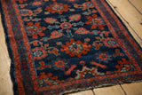 Delicately contoured madder red floral border and secure side of antique Lilihan rug.