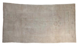 Distressed vintage Oushak carpet, worn triple medallion, palmette border, muted mauve, ivory, beige, 4'10