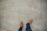 Distressed vintage Oushak carpet with soft beige pile and subtle, aged tonal shifts.