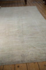 Evenly worn pile texture of a distressed vintage Oushak, showing subtle tone-on-tone shades.