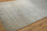 Distressed Oushak carpet pile showing even wear to knot heads and faded tone-on-tone beige.