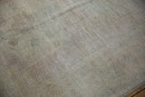Distressed vintage Oushak carpet pile texture, showcasing even wear and muted beige hues.