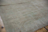 Distressed hand-knotted Oushak rug pile featuring soft texture in beige and ivory.