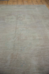 Distressed pile and subtle patterns of a vintage Oushak carpet with even wear.