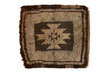 Vintage Oushak square mat with geometric starburst, wave motif, thick pile, dark brown and beige tones.