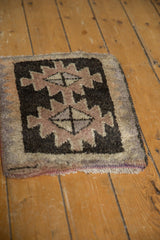 Vintage Oushak rug detail: thick pile, charcoal and pale mauve geometric zig-zag border.