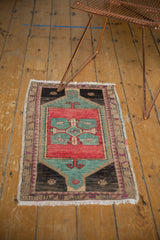 Distressed pile, fringed edge, and rose blush aqua border on vintage Oushak mat.
