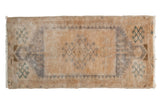 Distressed Oushak rug mat with faded central medallion, beige, sand, and mallard green motifs.