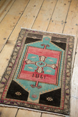Distressed rose blush and aqua blue Oushak pile, showing date '1981' and plum borders.