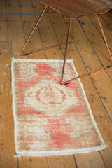 Distressed vintage Oushak rug showcasing a softened blush, beige, and sand palette.