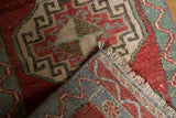 Hand-knotted Oushak rug's reverse and fringe, with its distressed pile showing even wear.