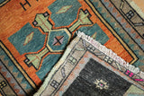 Hand-knotted reverse and distressed pile with pink edge on vintage Oushak rug.