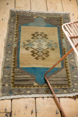 Distressed Oushak rug fringe and textured low pile, with geometric blue border.