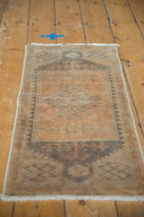 Distressed vintage Oushak rug side, low pile texture and geometric border in beige, apricot, silver.