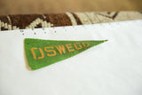 Vintage green felt Oswego pennant, showing yellow text and minor pinholes.