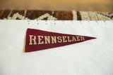 Vintage Rennselaer felt pennant detail with cream 'SELAER' text and pointed tip.
