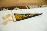 Detail of vintage Mizzou felt pennant with yellow seal, 
