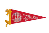 Vintage red Crystal Cave PA felt pennant with yellow ties and 1960s cave graphic.