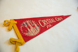 Yellow felt ties and creased red body of the Crystal Cave pennant.