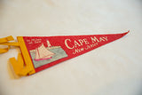 Red felt Cape May pennant showing sailboat, lighthouse, 