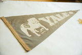 Textured vintage Yale felt pennant with bulldog graphic and tan edge binding detail.