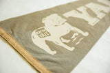 Vintage Yale felt pennant's aged texture, bulldog with 'Beat 'Em Yale' text, brown binding.