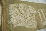 Native American profile and headdress design on faded green felt pennant.