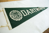 Textured deep green felt with cream school seal and binding of a vintage pennant.