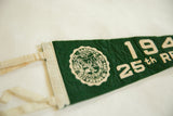 Close-up view of the Dartmouth college seal on the vintage green felt pennant.
