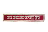 Vintage 1940s Exeter felt banner with white letters on red and cream border. 5x31.