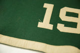 Cream '19' felt applique and green banner background with bottom border.