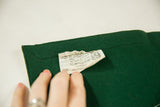 Textured dark green felt of the vintage banner with its white Chicago Pennant Co. tag.