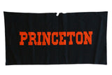 Vintage black felt Princeton University banner with orange letters and torn top edge.