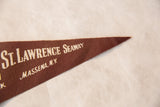Vintage St. Lawrence Seaway felt pennant's brown pointed tip with cream 'MASSENA, N.Y.' lettering.