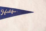 Vintage blue felt pennant with 'Halifax' in elegant cream script.
