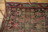 Close-up of exposed foundation and threadbare Herati pattern on the antique Karabagh rug.