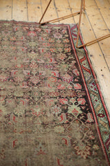 Antique Karabagh rug corner, cherry red serrated leaf border, Herati motifs, and exposed foundation.
