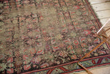 Heavily worn pile of an antique Karabagh rug, showcasing exposed foundation and faded Herati motif.