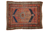 Antique Kurdish square rug: madder red field, navy stepped medallion, corner overlays. Patina, 3'6